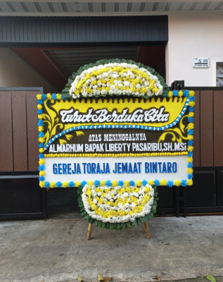Papan Bunga Duka di Beber